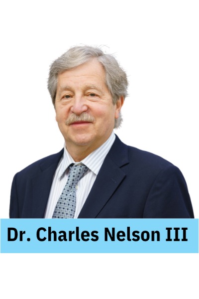 ID: A caucasian-presenting man with short gray hair and a gray mustache is smiling.